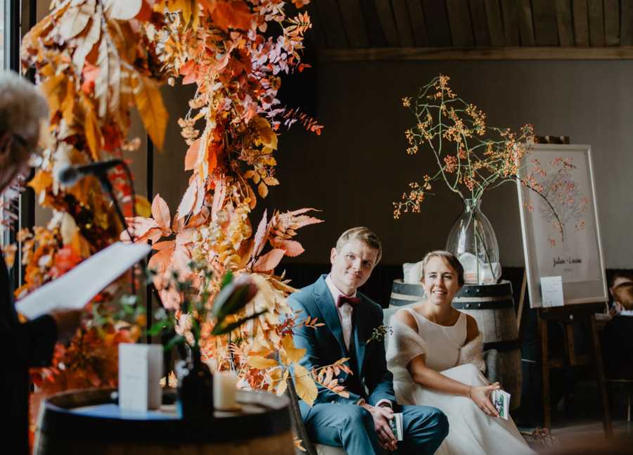 wedding ceremony with a autumn arch