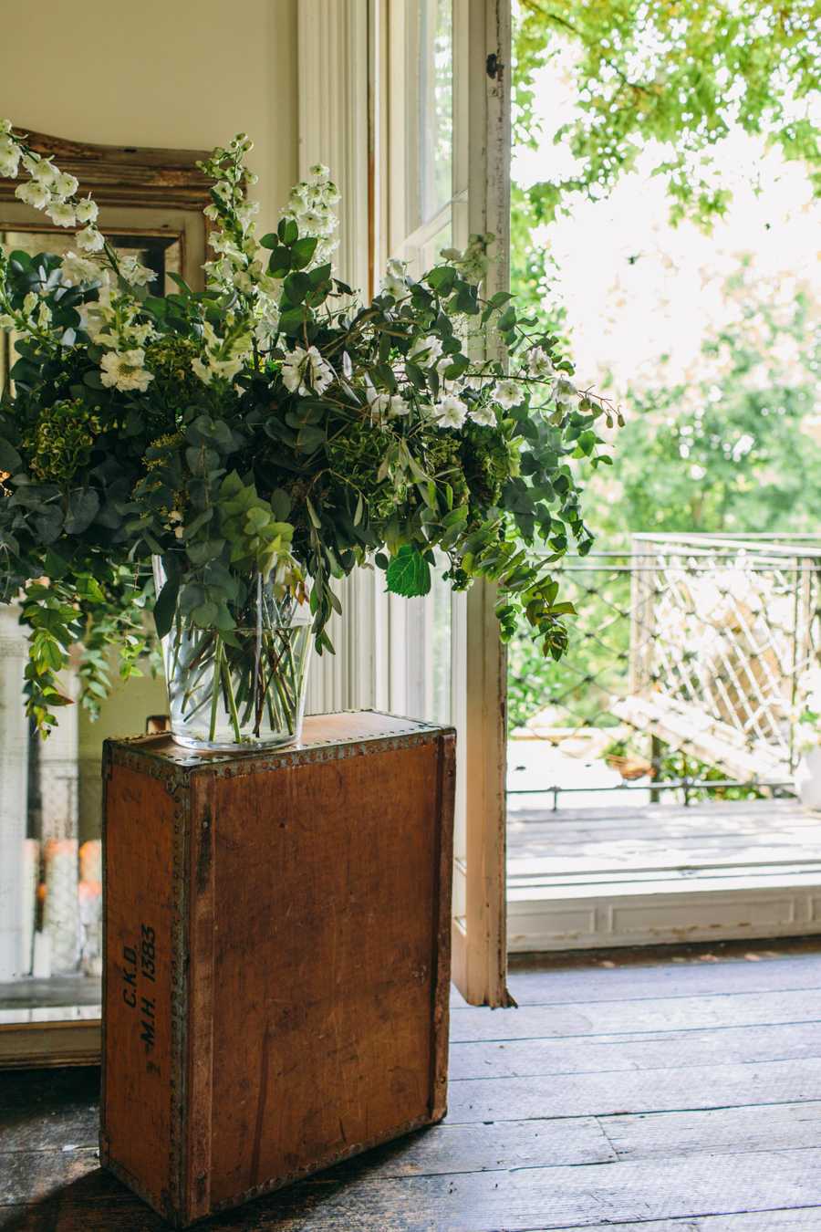 tall grene bouquet in a vase